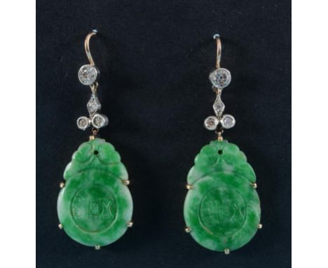 A pair of carved jade and diamond drop earrings  See illustration