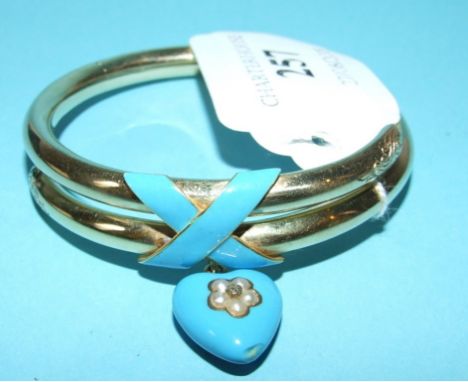 A Victorian bangle, with turquoise enamel decoration, and turquoise enamel heart suspension set seed pearls and a diamond flo