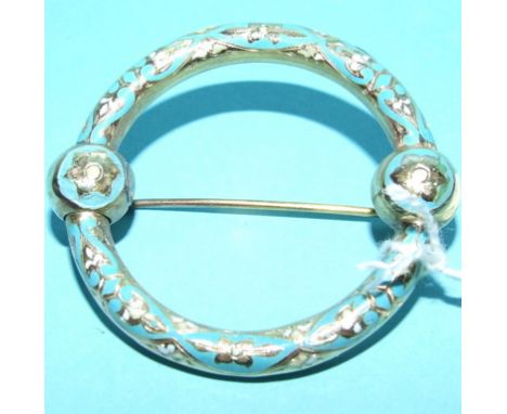 A yellow coloured metal and enamel Scottish type brooch