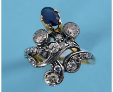 A yellow coloured metal, sapphire and diamond dress ring  See inside front cover colour illustration