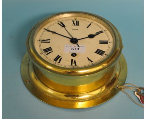 A ship's bulkhead clock, in a brass case, 20 cm diameter Condition report with key