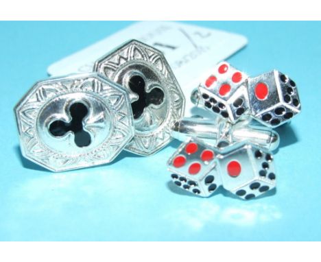 A pair of silver cufflinks, in the form of die, and another pair (2)