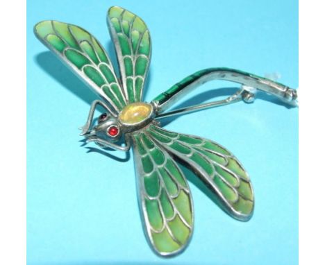 A silver coloured metal and enamel dragonfly brooch, with cabochon opal body and ruby eyes, with green enamel plique-a-jour e