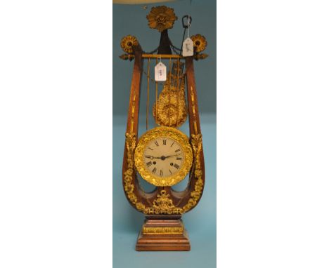 A mantel clock, in the form of a lyre, 65 cm high