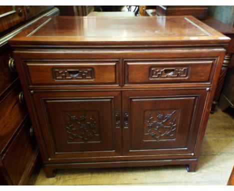 A Chinese sideboard, with two frieze drawers and two panel doors, 88.5 cm wide
