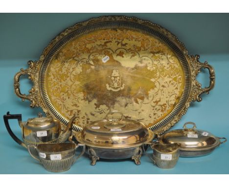 A silver plated warming dish and cover, a similar entree dish, a three piece tea service, and a two handled tray (6)