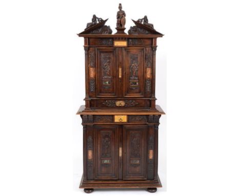 A 16th century style walnut and marble inlaid cabinet, in the Renaissance taste, the architectural pediment carved and applie