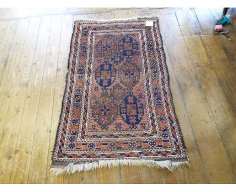 A Persian rug, decorated medallions, on a brown ground, 133 x 85 cm