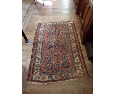 A Persian rug, decorated geometric motifs, on an orange ground, 190 x 124 cm Condition report Report by GH

Generally reasona