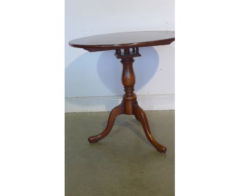 A Georgian style tripod table with a birdcage action 
