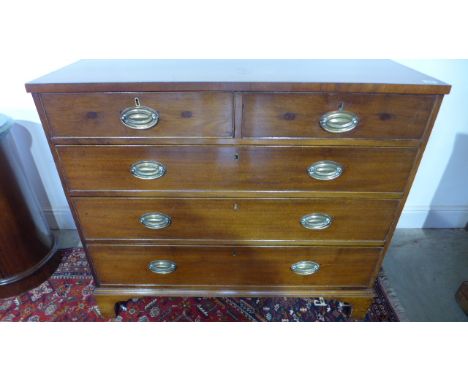 An Early 19th Century Mahogany Chest of Drawers with two short over three long drawers on bracket feet - sound condition and 