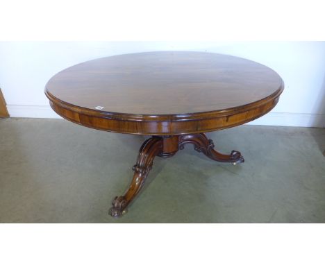 A good quality Victorian Rosewood breakfast table on a carved scroll tripod base, 71cm tall x 136cm diameter - in good clean 