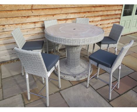 A Bramblecrest 122cm woven round bar with ceramic top and six bar stools with grey cushions 