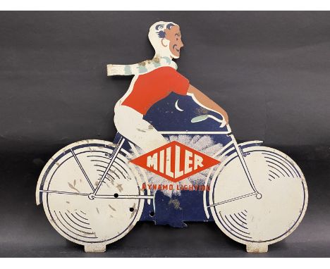 A Miller 'Dynamo Lighting' die-cut pictorial tin advertising sign in the form of a man riding a bicycle. 