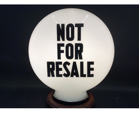 A 'Not For Resale' pill shaped glass petrol pump globe by Hailware, one chip to neck otherwise good. 