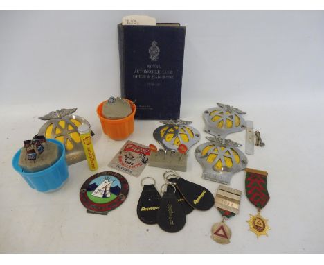 An AA badge and handbook, three further AA badges, various tie pins, keyrings, a camping car badge etc. 