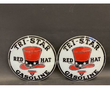 A pair of petrol pump globe glass panels from a 1982 reproduction globe advertising Tri-Star Gasoline, each 13 1/2" diameter.