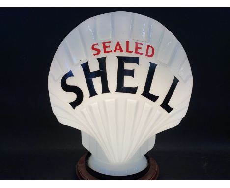 A reproduction Sealed Shell glass petrol pump globe, good condition. 