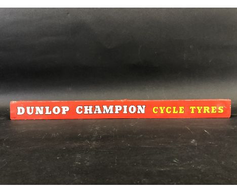 A Dunlop Champion Cycle Tyres shelf strip.