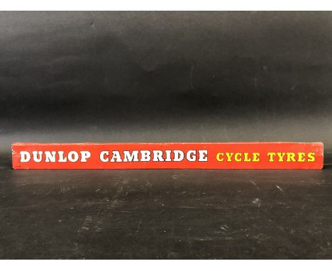 A Dunlop Cambridge Cycle Tyres shelf strip.