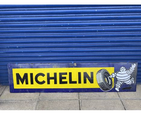 A Michelin rectangular enamel sign with image of Mr. Bibendum rolling a tyre at one end, 77x 18". 