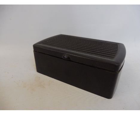 A Joseph Lucas bakelite cigar box. 