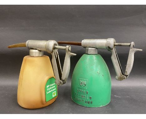 A BP Upper Cylinder Lubricant aluminium dispensing gun and a later plastic version. 