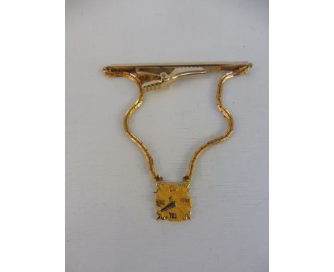 A Goodyear 20 year service pendant on tie clip.