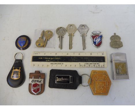 A Ford Main Dealer Burgess &amp; Garfield of Yardley enamel badge plus a selection of keyrings and promotional items, also an