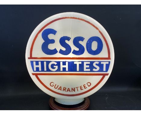 A rare and early Esso High Test Guaranteed glass petrol pump globe in very good condition, fully stamped underneath. 