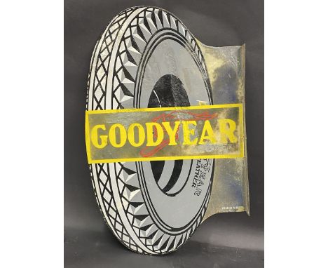 A Goodyear tyre shaped double sided enamel sign with hanging flange by Franco, some old amateur retouching, 22 1/2 x 34 1/2".