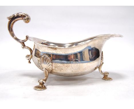 Silver sauce boat on tripod legs terminating in scallop feet, possibly by Wakely &amp; Wheeler, London 1920, 9oz. 