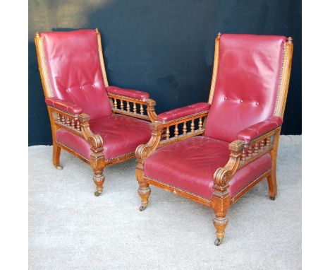 Pair of mid Victorian oak armchairs, each with cushioned back, balustrade arms, sprung seat, raised on bulbous turned legs an