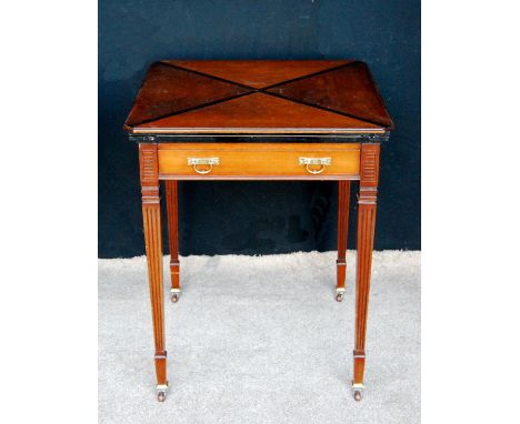 Edwardian mahogany envelope table with frieze drawer, raised on fluted square tapering legs terminating in ceramic castors, 5