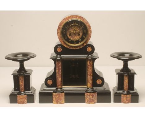 A FRENCH BLACK SLATE AND ROUGE MARBLE CLOCK GARNITURE by Samuel Marti, the twin barrel movement with exposed Brocot escapemen