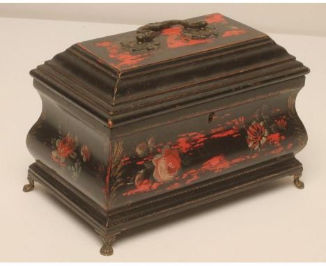 A GEORGIAN BLACK LACQUERED TEA CADDY, 18th century, of sarcophagus form painted with flowers and fruit and gilt embellished, 