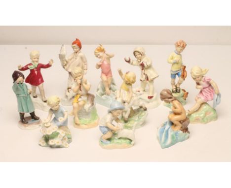 A SET OF TWELVE ROYAL WORCESTER CHINA FIGURES, 1950's, modelled by Freda Doughty and allegorical of the Months of the Year, b
