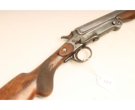 A 20 BORE SINGLE BARREL FOLDING ACTION HAMMER SHOTGUN BY KABA, with 27 3/4" barrel, side lever, pistol grip, walnut stock and