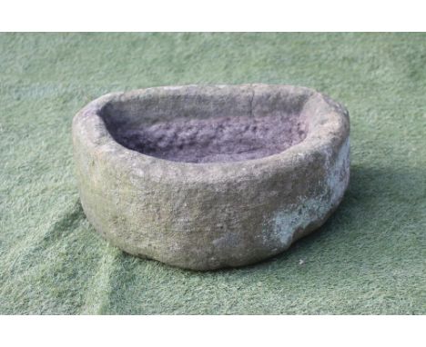 A SANDSTONE TROUGH of D form, well cut, 22" x 17" x 8 1/2"  (Est. plus 18% premium inc. VAT) (Illustrated)