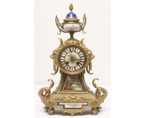 A FRENCH GILT METAL AND PORCELAIN TABLE CLOCK by Japy Freres et Cie, the twin barrel movement striking on a bell, 4" porcelai