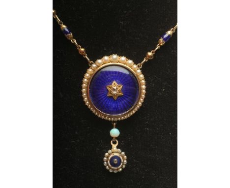 A VICTORIAN NECKLACE, the link and ball chain with ten blue bead spacers and fixed to a blue guilloche enamelled roundel cent