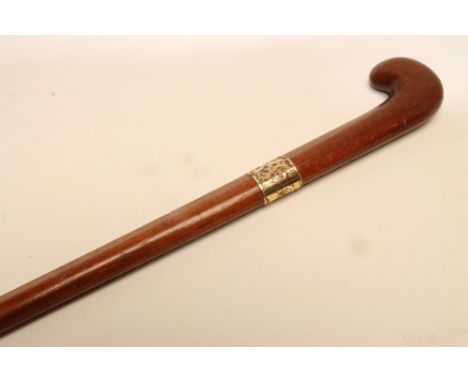 A FIRST WORLD WAR PROPELLER WALKING CANE, with shaped grip and 18ct gold plated ferrule engraved with foliage, 36 1/4" long (