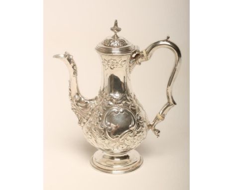 A GEORGE I SILVER HOT WATER JUG, maker possibly John Eckford II, London 1725, of baluster form, the hinged cover with square 