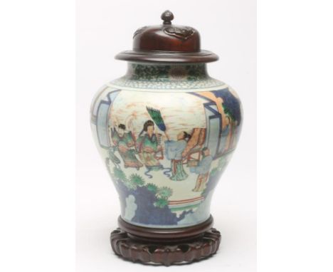 A CHINESE PORCELAIN JAR of inverted baluster form, painted in underglaze blue and overpainted in polychrome enamels with figu