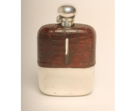 A LARGE EDWARDIAN  PLATED HUNTING FLASK, the leather bound glass body with removable cup and twist release hinged top, 8 1/4"