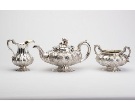 A WILLIAM IV SILVER THREE PIECE TEA SERVICE, maker Robert Hennell, London 1834, of lobed squat globular form on a low florifo