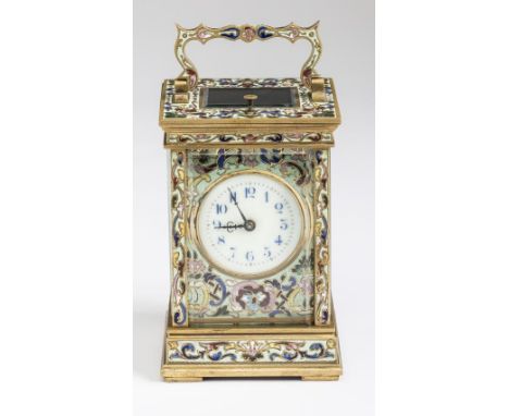 A FRENCH BRASS AND CHAMPLEVE ENAMEL CARRIAGE CLOCK, c.1900, the twin barrel repeater movement striking on a gong, cream ename