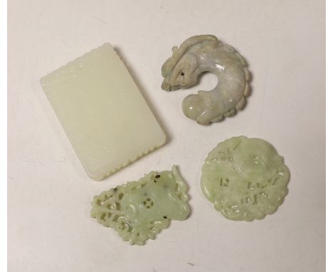A Chinese white jade pendant plaque and three jadeite pendants, largest 7cm