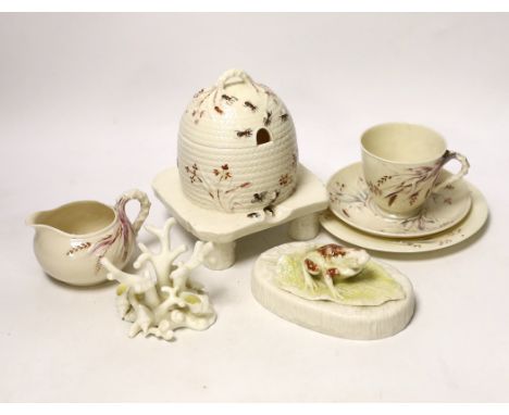 A small quantity of 1st and 2nd period Belleek including a ‘frog’ paperweight and a ‘beehive’ honey jar together with a relat
