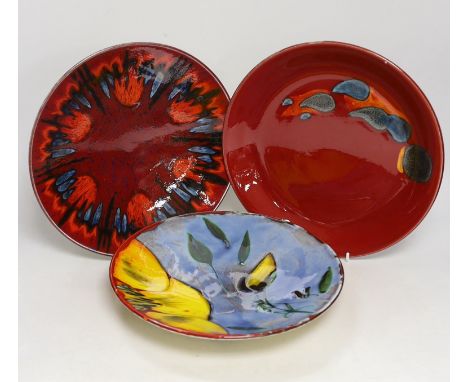 Three Poole Pottery ‘Delphis’ wall plates, 25cm